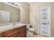 Bathroom features a vanity and a toilet at 1104 Ketzal Dr, Trinity, FL 34655