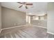 Lofted bonus room with neutral carpet, ceiling fan, and adjacent rooms at 1104 Ketzal Dr, Trinity, FL 34655
