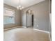 Bright dining room features an arched entry, tile floors, and chandelier lighting at 1104 Ketzal Dr, Trinity, FL 34655