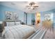 Serene primary bedroom featuring a queen-sized bed, wood dresser, and plenty of natural light at 1104 Ketzal Dr, Trinity, FL 34655