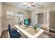 Bright home office with a large window, desk, and chair, perfect for remote work or study at 1104 Ketzal Dr, Trinity, FL 34655