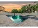 Backyard in-ground pool and spa, with lush tropical landscaping and a privacy fence at 1104 Ketzal Dr, Trinity, FL 34655