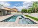 In-ground pool and spa, with tropical landscaping at 1104 Ketzal Dr, Trinity, FL 34655