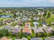 The house is located in a meticulously maintained community with lush landscaping, mature trees, and inviting green spaces at 11144 Brambleleaf Way, Hudson, FL 34667