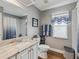 Bathroom featuring a spacious vanity, toilet, and a shower with a curtain at 11144 Brambleleaf Way, Hudson, FL 34667