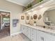 Bright bathroom features double sinks, and easy access from the Primary bedroom at 11144 Brambleleaf Way, Hudson, FL 34667