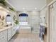 Elegant bathroom boasts double sinks, soaking tub, and a separate shower, creating a spa-like experience at 11144 Brambleleaf Way, Hudson, FL 34667