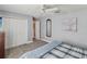 Bedroom with a ceiling fan and a double closet, offering ample storage space at 11144 Brambleleaf Way, Hudson, FL 34667