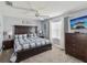 Comfortable bedroom featuring a large bed and warm, inviting decor at 11144 Brambleleaf Way, Hudson, FL 34667