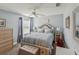 Cozy bedroom features blue accents, bedside tables, and a comfortable bed at 11144 Brambleleaf Way, Hudson, FL 34667