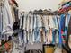 Walk-in closet filled with clothing provides ample storage space for an organized lifestyle at 11144 Brambleleaf Way, Hudson, FL 34667