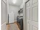 Practical laundry room with washer, dryer, and additional storage space at 11144 Brambleleaf Way, Hudson, FL 34667