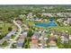 The property sits in a neighborhood featuring mature trees, a pond, and golf course, all within close proximity at 11144 Brambleleaf Way, Hudson, FL 34667
