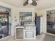 A built-in outdoor kitchen featuring a stainless steel grill, refrigerator, and countertop space for preparing meals at 11144 Brambleleaf Way, Hudson, FL 34667