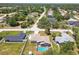 Desirable home featuring a screen-enclosed pool, a fenced yard, and mature trees in a quiet neighborhood at 11280 Sedgefield Ave, Spring Hill, FL 34608