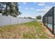 Spacious fenced backyard with a shed and a screen-enclosed pool visible, perfect for outdoor activities at 11280 Sedgefield Ave, Spring Hill, FL 34608