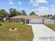 Beautiful one-story home featuring an attached garage, a well-manicured lawn, and charming curb appeal at 11280 Sedgefield Ave, Spring Hill, FL 34608