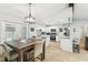 Bright open kitchen with stainless steel appliances and views to the dining and living spaces at 11280 Sedgefield Ave, Spring Hill, FL 34608