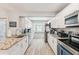 Well-lit kitchen features stainless steel appliances and large window over the sink area at 11280 Sedgefield Ave, Spring Hill, FL 34608
