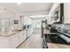 Well-lit kitchen features stainless steel appliances and large window over the sink area at 11280 Sedgefield Ave, Spring Hill, FL 34608