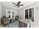 Covered patio seating area featuring a ceiling fan and neutral outdoor furniture at 11280 Sedgefield Ave, Spring Hill, FL 34608