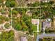 Aerial view of property boundaries showcasing a lush landscape, house, and outlining property lines at 12229 Barnevelde Rd, Weeki Wachee, FL 34614