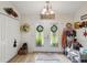 Bright entryway featuring decorative double doors, wood floors, and ample closet space, offering a warm welcome at 12229 Barnevelde Rd, Weeki Wachee, FL 34614