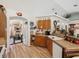 Practical kitchen featuring wood cabinets, laminate countertops, and essential appliances, providing convenience for home chefs at 12229 Barnevelde Rd, Weeki Wachee, FL 34614