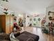 Open living area showcasing wood floors, connecting spaces, and natural light, creating a seamless flow throughout the home at 12229 Barnevelde Rd, Weeki Wachee, FL 34614