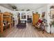 Open-concept living room with wood floors and decorative archways, perfect for entertaining and relaxation at 12229 Barnevelde Rd, Weeki Wachee, FL 34614