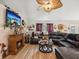 Cozy living room with a fireplace, wood floors, and comfortable seating, perfect for relaxing evenings at home at 12229 Barnevelde Rd, Weeki Wachee, FL 34614
