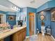 Well-appointed main bathroom features a dual sink vanity, mirror, and walk-in shower, ensuring convenience and comfort at 12229 Barnevelde Rd, Weeki Wachee, FL 34614