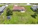 Aerial view of the home highlighting the spacious backyard and patio at 12323 House Finch, Weeki Wachee, FL 34614