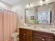 Bathroom features a double sink vanity with granite counters and tile floors at 12323 House Finch, Weeki Wachee, FL 34614