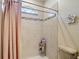 Light, airy bathroom features a tiled shower with glass door and a decorative accent at 12323 House Finch, Weeki Wachee, FL 34614