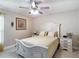 Sunny bedroom featuring neutral colors, a ceiling fan and tile flooring at 12323 House Finch, Weeki Wachee, FL 34614