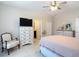 This bedroom boasts a sitting area, dresser and bright, neutral walls at 12323 House Finch, Weeki Wachee, FL 34614