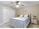 Bedroom featuring a bed with white wooden frame, patterned bedspread, and closet at 12323 House Finch, Weeki Wachee, FL 34614