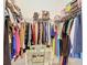 Well-organized walk-in closet with ample hanging space, shelving, and a vanity at 12323 House Finch, Weeki Wachee, FL 34614