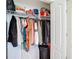 Walk-in closet with wire shelving, organized hanging clothes, and suitcases at 12323 House Finch, Weeki Wachee, FL 34614