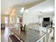 Open-concept dining area showcasing a wooden table, stylish chairs, and seamless flow to the living room at 12323 House Finch, Weeki Wachee, FL 34614