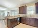 Kitchen featuring granite countertops, stainless steel appliances, and an adjacent dining area at 12323 House Finch, Weeki Wachee, FL 34614
