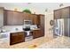 Modern kitchen featuring granite countertops, stainless steel appliances, and ample cabinet space at 12323 House Finch, Weeki Wachee, FL 34614