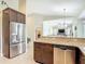 Modern kitchen featuring stainless steel appliances, granite countertops, and open layout at 12323 House Finch, Weeki Wachee, FL 34614