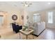 Bright living area boasts tile floors, a large window, and stylish furnishings for comfortable living at 12323 House Finch, Weeki Wachee, FL 34614