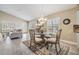 Bright dining area with a glass top table, lots of light, and an open floorplan at 1242 Almondwood Dr, Trinity, FL 34655