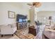 Inviting living room with a ceiling fan, comfortable seating, and lots of natural light at 1242 Almondwood Dr, Trinity, FL 34655
