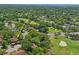 Overhead view showcasing the home's proximity to the golf course and surrounding landscape at 13009 Wedgewood Way # 63-D, Hudson, FL 34667