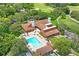Aerial view of community swimming pool, clubhouse, and golf course at 13009 Wedgewood Way # 63-D, Hudson, FL 34667