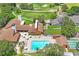 Aerial view showcasing the community swimming pool and golf course at 13009 Wedgewood Way # 63-D, Hudson, FL 34667